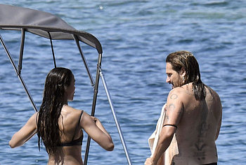 Zoe Saldana sunbathing