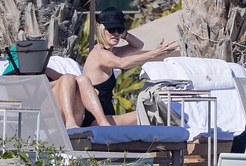 Charlize Theron side boobs